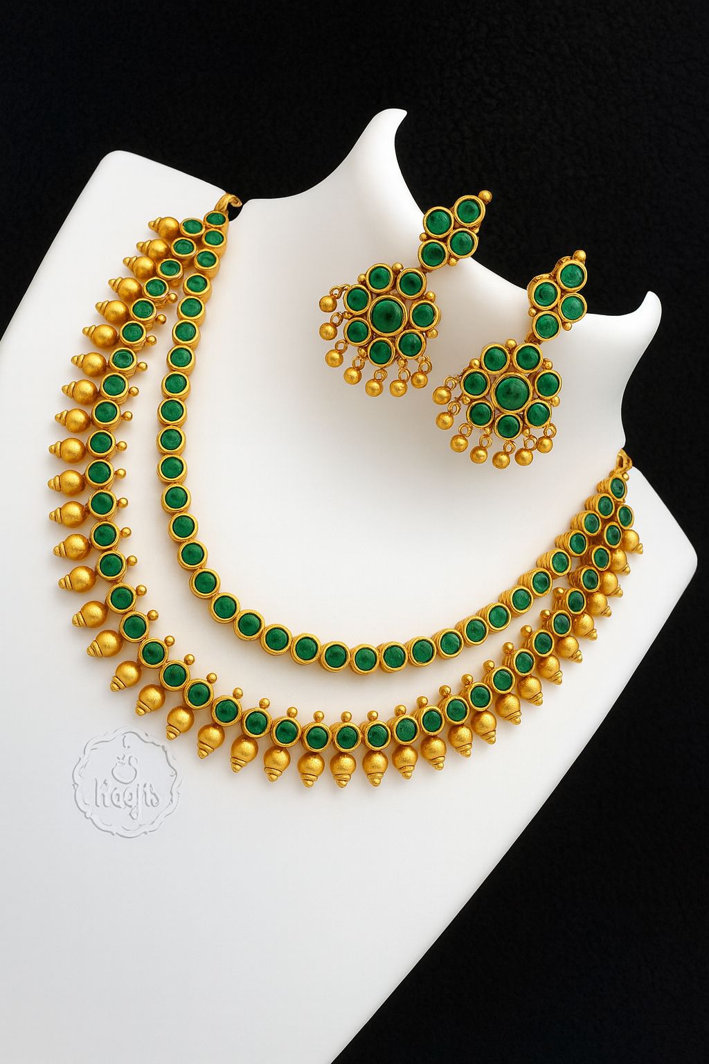 A stunning blend of gold artistry and emerald-green brilliance, a royal touch to your every look