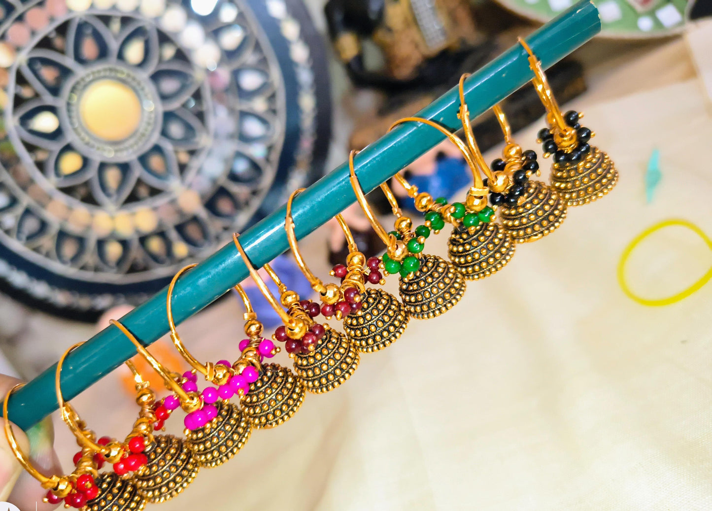 Gold plated ring hanging small jimukha with beads