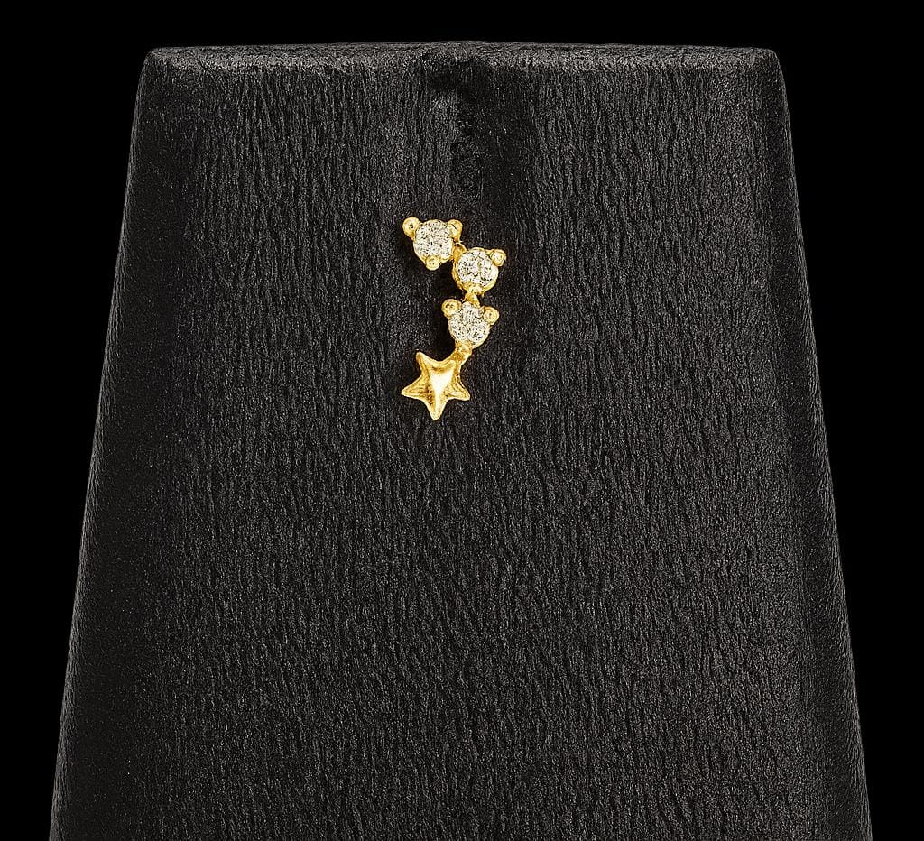 Small three white stone with golden star nose pin and second stud