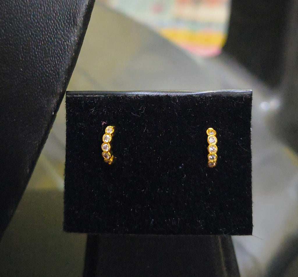 Ring shaped white stone nose pin and second stud