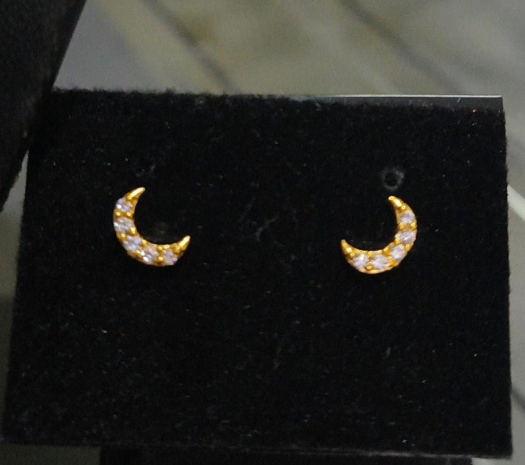 Half-moon shaped small size white stone and red stone nose pin and second stud