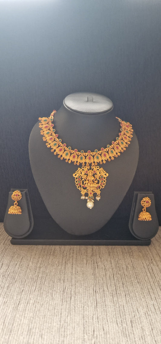 peacock designed chain with saraswati motif pendent with jimkha earrings
