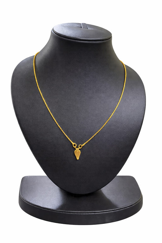 Gold covering Hindu religion thali with simple chain