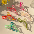 Glass finished twisted hair clutches
