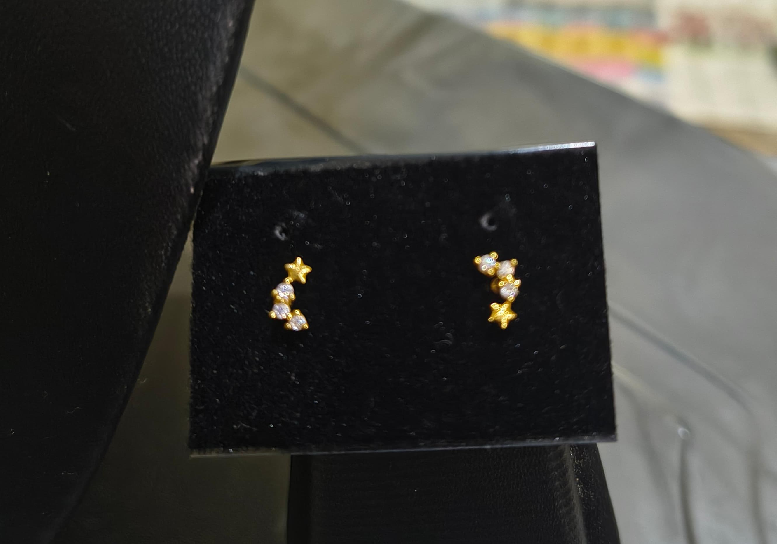 Small three white stone with golden star nose pin and second stud
