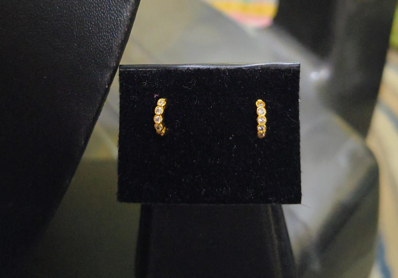 Ring shaped white stone nose pin and second stud