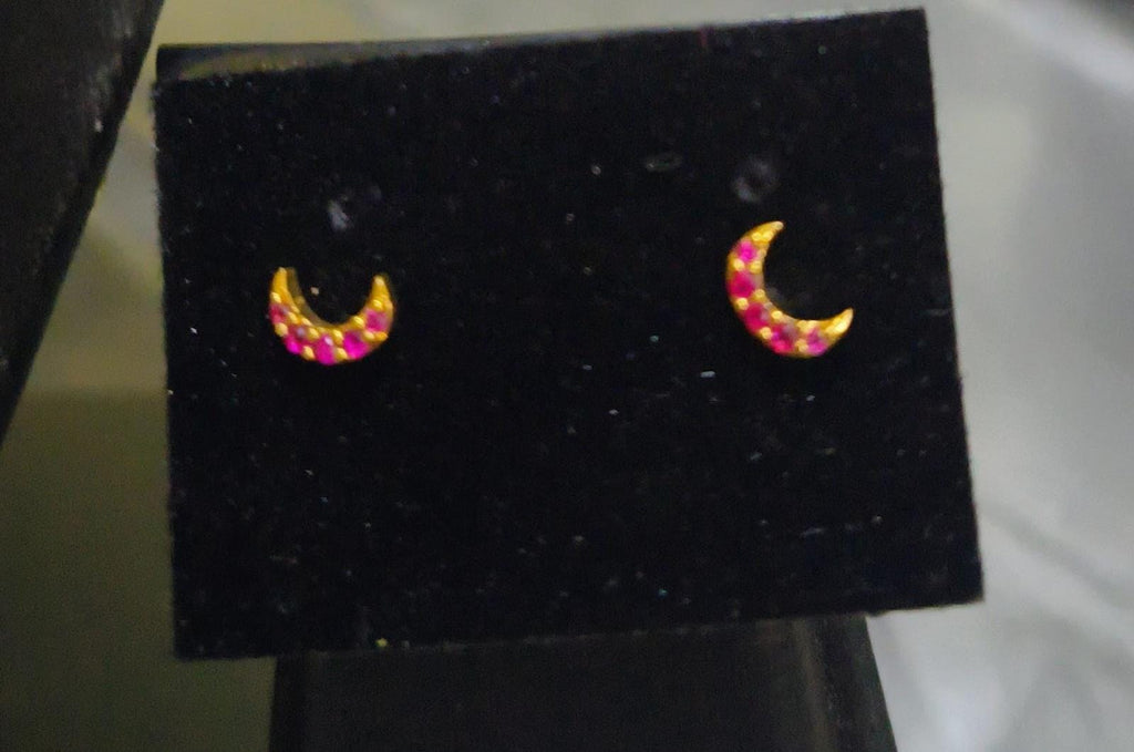 Half-moon shaped small size white stone and red stone nose pin and second stud